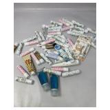 Travel size lot of shampoo, lotion, and chap