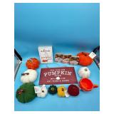Lot of decorative pumpkins, signs, and coffee mug