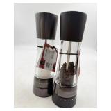 Mis-matched Cole and Mason Salt and Pepper Mills.