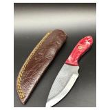 Fixed blade hunting knife with textured steel blad