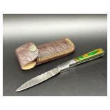 Damascus folding pocket knife with green and orang