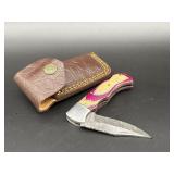 Custom Damascus folding bunting knife with colorfu