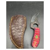compact short skinner or mini-karambit style fixed