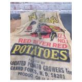 Suitcase Full of Red River Potato Sacks