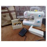 Singer Sewing Machine.  Powers on, needle moves