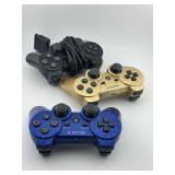 Three Playstation Controllers