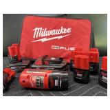 Large Lot of Milwaukee Batteries and Bag