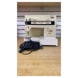Finesse 834 free-arm sewing machine with Case a