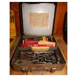 Tin Box With An Assortment of Drill Bits