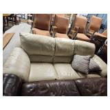 Cream Leather Sectional Sofa with Throw Pillows