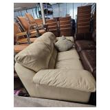 Cream Leather Sectional Sofa with Throw Pillows