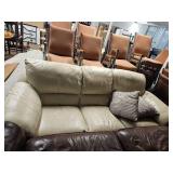 Cream Leather Sectional Sofa with Throw Pillows