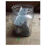 Various household items in plastic jug