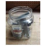 Various household items in plastic jug