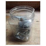 Various household items in plastic jug