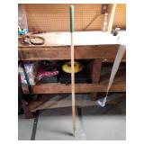 Long Handle with nail on end.