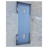 Skid steer mounting plate