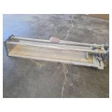 Set of Two Tile Cutters and Folding Base for Equipment.