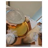 Assorted candles, silver metal plate, gold medal plates
