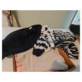Lady size medium sweaters, one black and white puffy sleeve