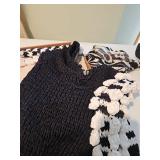 Lady size medium sweaters, one black and white puffy sleeve