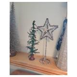 Small decorative Christmas tree and silver Garland star