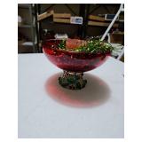 Red Christmas dish with candle