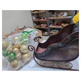 Metal Christmas sleigh and bag of ornaments