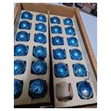 Four boxes of small blue ornaments