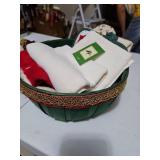 Small Christmas basket with Christmas themed towels and potholders