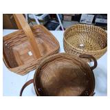 Two Longaberger baskets and one woven grass basket