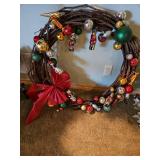 Large decorative grapevine wreath with ornaments