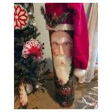 Santa face curved into log