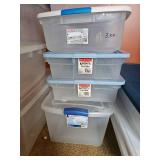 Four clear plastic totes