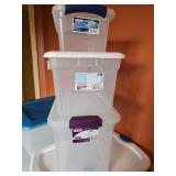 Three small clear plastic totes with lids