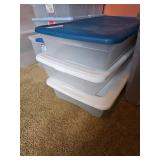 Three long shallow plastic totes with lids
