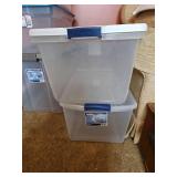 Two clear plastic storage totes with lids