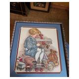 Approximately 13x13 needlepoint of child and toys