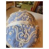 Pink and blue lace covered pillows