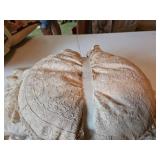Two small lace covered pillows