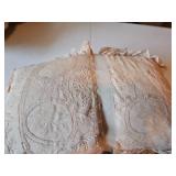 Two small lace covered pillows