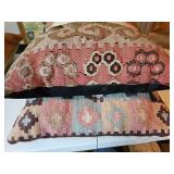 To pink and blue and cream colored Southwest themed pillows