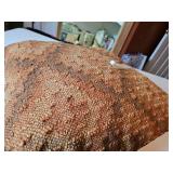 Brown and gold colored decorative pillow