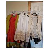 Orange and green two-piece skirt and jacket outfit, one long white lace bottom sleeveless shirt, one Lacey over shirt all size medium