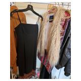 Long black dress with fringe and fur vest