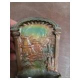Cast iron book support.