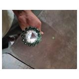Glass piece with marble on top.