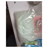 Assortment of laundry detergent and cleaning chemicals