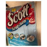 Assortment of laundry detergent and cleaning chemicals