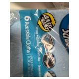 Assortment of laundry detergent and cleaning chemicals